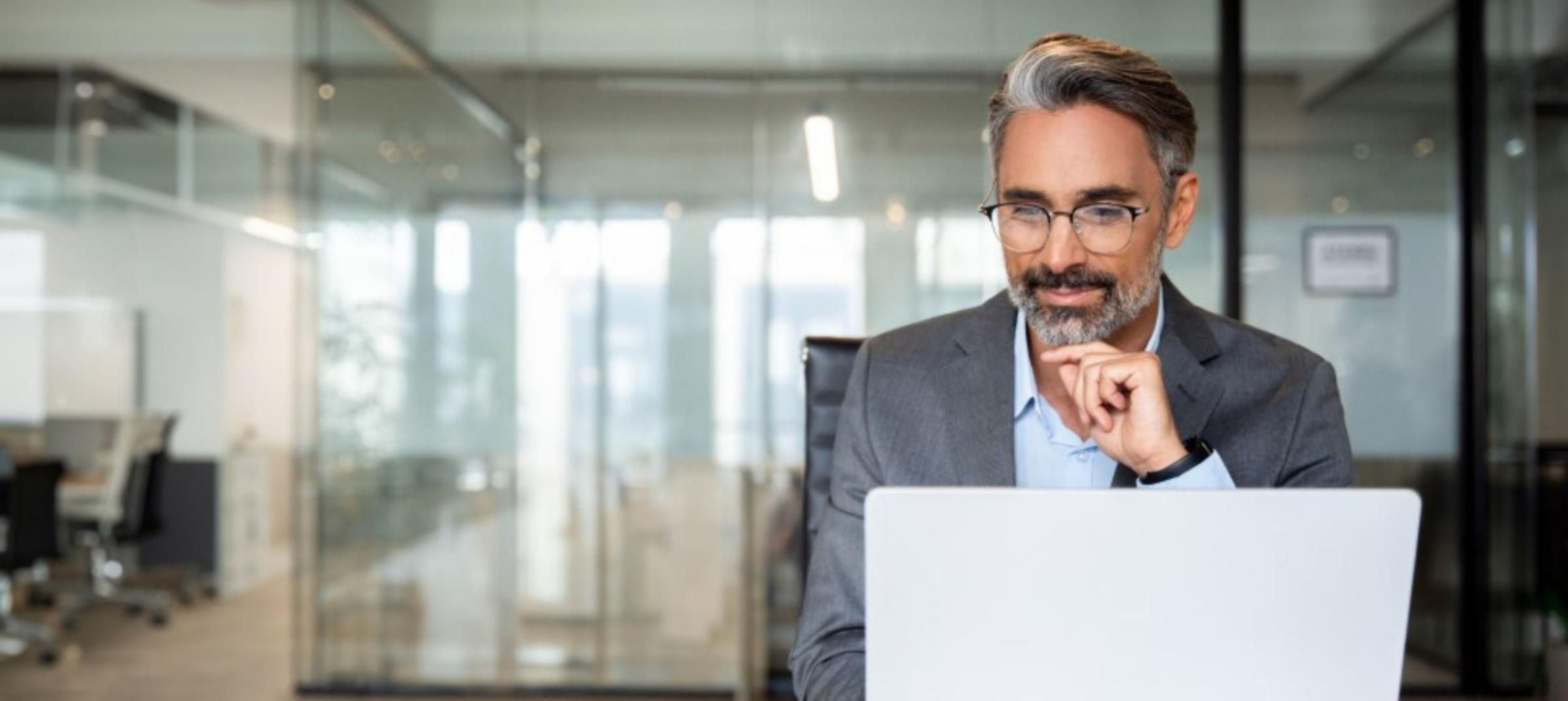 Journalist reviewing article leads with focused attention on opening paragraphs